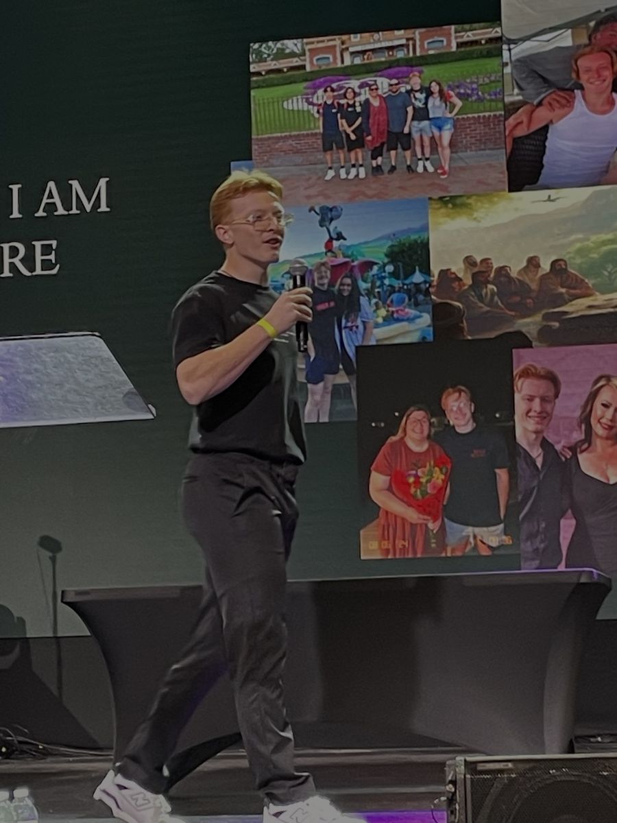 Alex Hastings speaking on stage