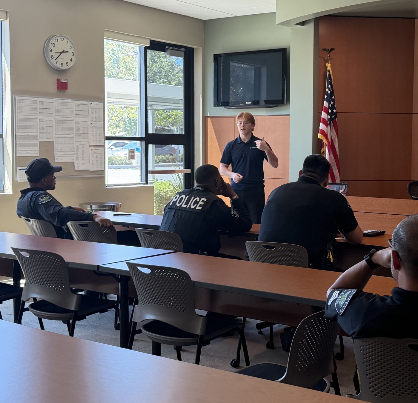 Alex Hastings teaching a financial wellness workshop to police officers